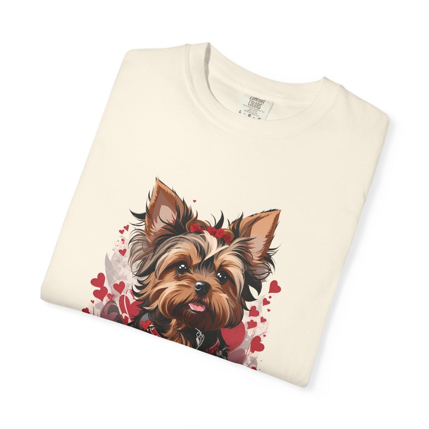 Folded beige 2000s style t-shirt with a cute Yorkshire Terrier dog graphic and red hearts on a white background