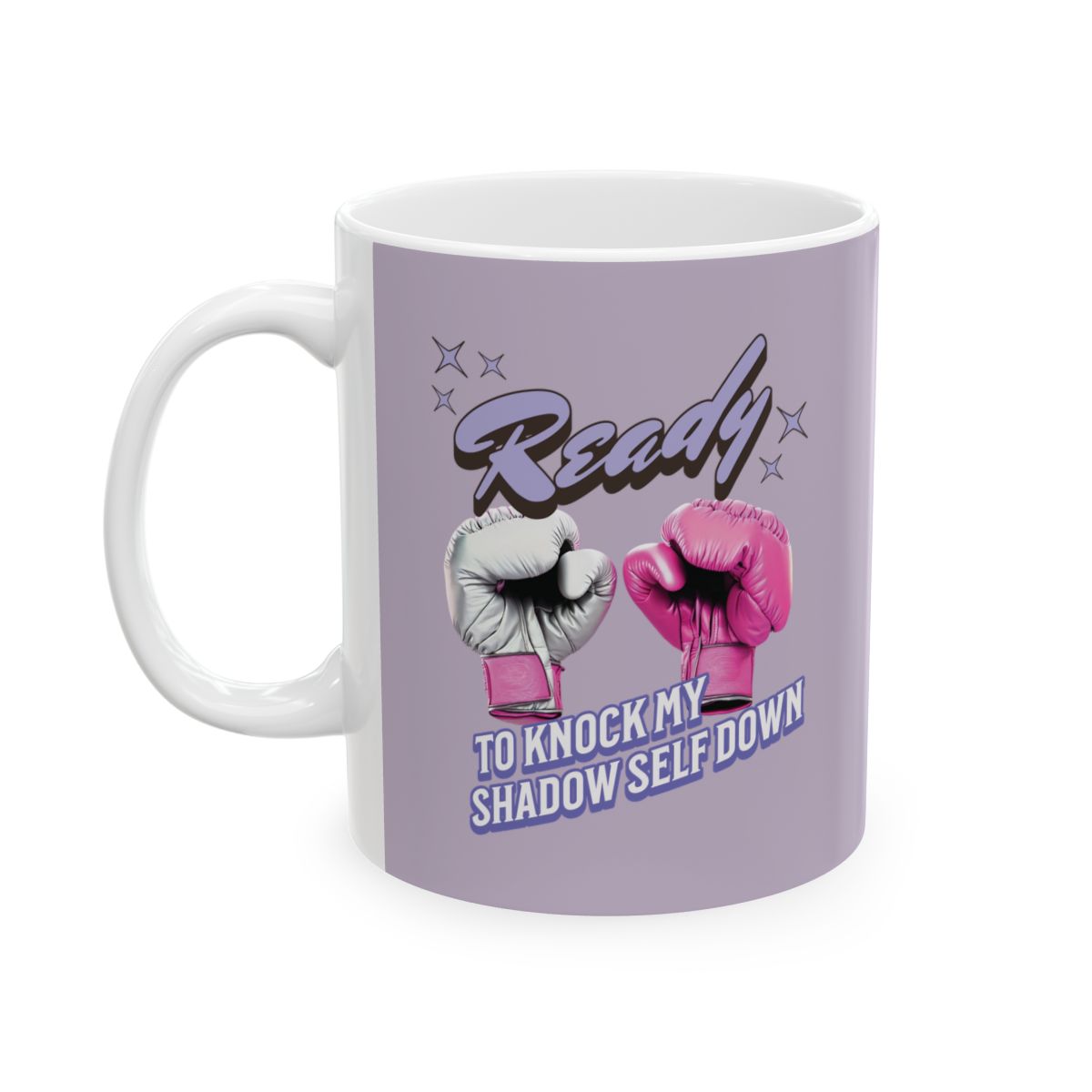 Mug with pink boxing gloves and text "ready" "to knock my shadow self down" written in retro style letters on a light purple background