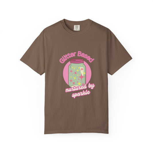 Brown t-shirt with a pastel colored graphic and pastel pink text 