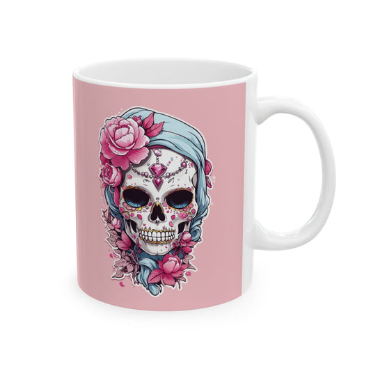 Pastel pink mug with a pastel colored  skull design wearing jewelry and pink flowers design on a pink background