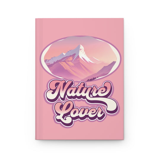 Pastel pink notebook with retro groovy style 'Nature Lover' text written in purple and pink, and a pink mountain illustration