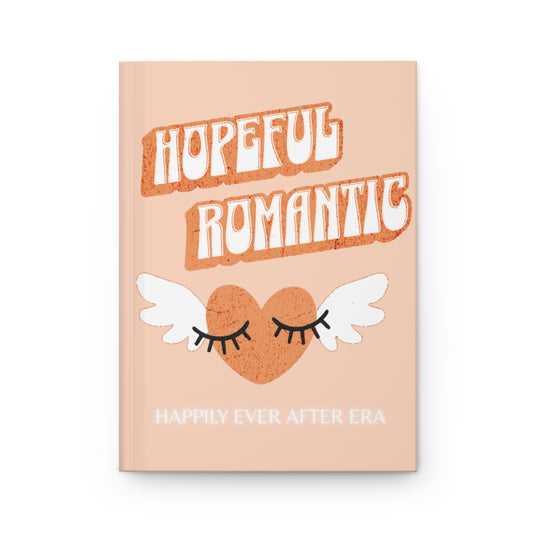 Notebook with 'Hopeful Romantic' text written in orange retro aesthetic letters and an orange heart with wings and eyelashes design, and "happily ever after era" text in white neon letters 