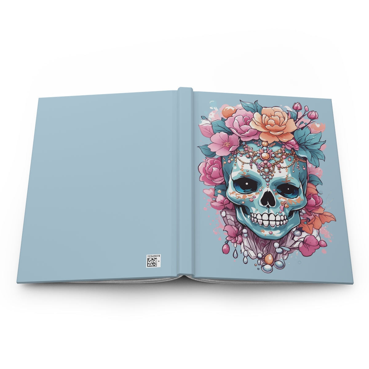 Open hardcover journal in pastel blue with fashionable skull illustration decorated with pastel colored flowers and jewelry