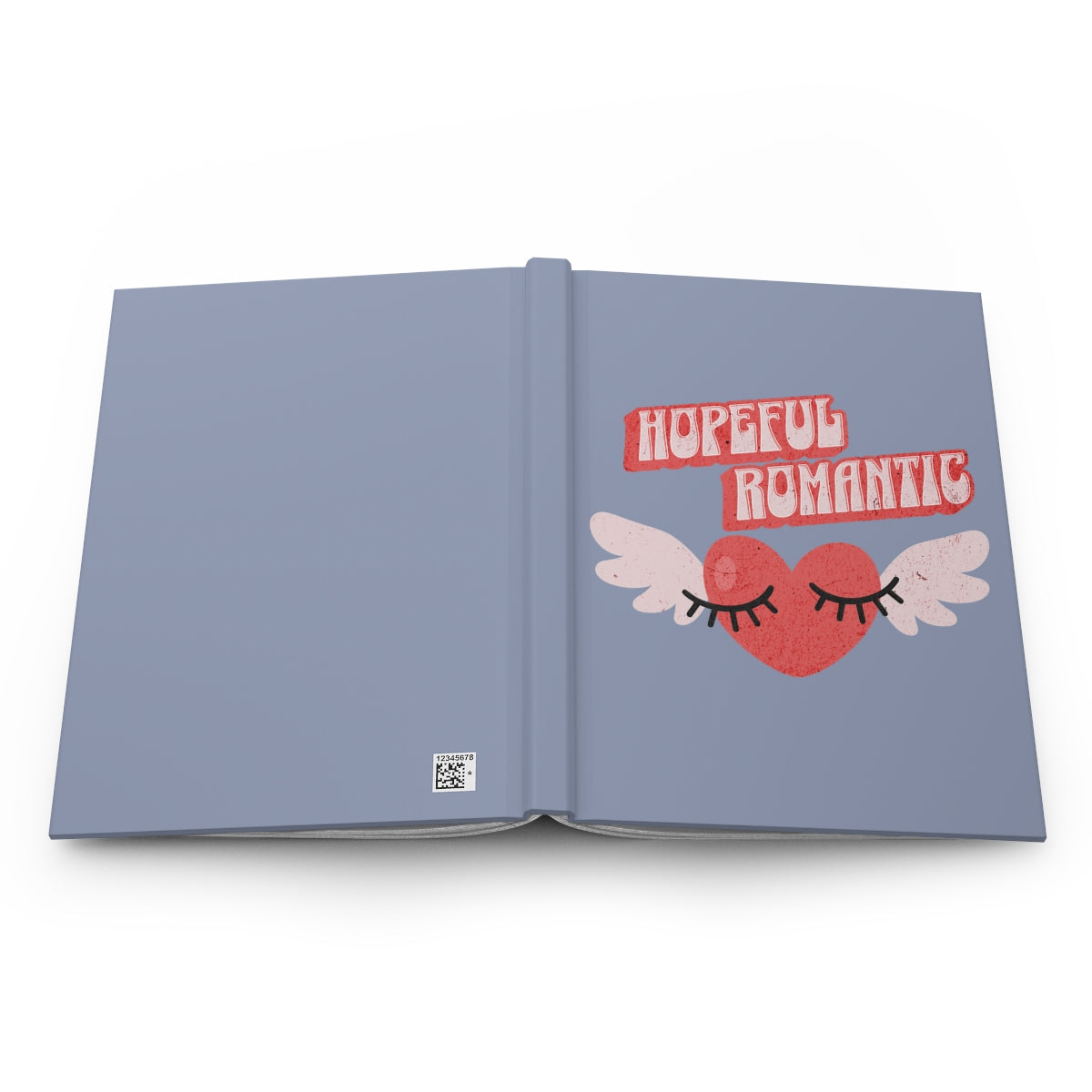 Open Notebook with a retro style red heart with wings design and 'Hopeful Romantic' text written in retro style letters, on a light blue background