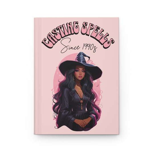 Pastel pink Journal with an Illustration of a beautiful witch girl with retro groovy aesthetic text 'Casting Spells Since 1990s' 