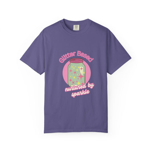 Purple t-shirt with a pastel colored graphic and y2k humour pink text 